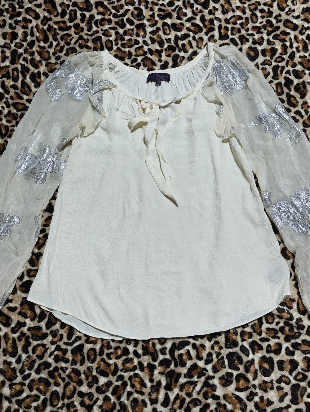 hale bob silk blend cream blouse with sheer sleeves and tie neckline